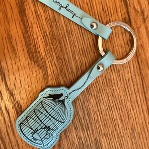 Longchamp “Be Happy” Light Blue Birdcage Keychain